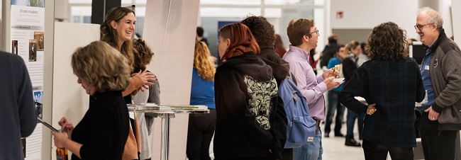 conference participants engaged in lively discussion